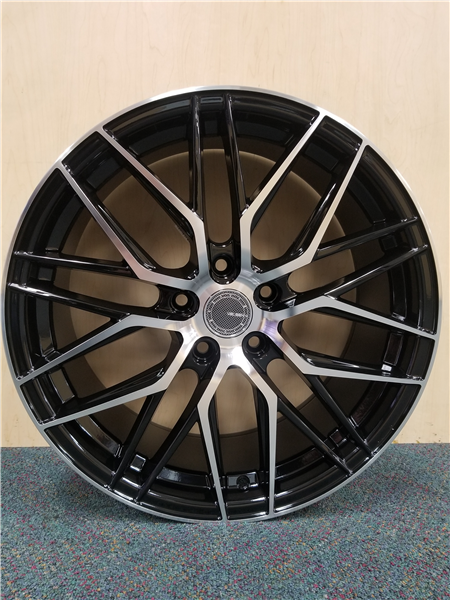 Sleek black alloy wheel with silver split-spoke design, perfect for car enhancement from Tires On Wheel.