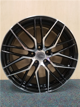 Load image into Gallery viewer, Sleek black alloy wheel with silver split-spoke design, perfect for car enhancement from Tires On Wheel.